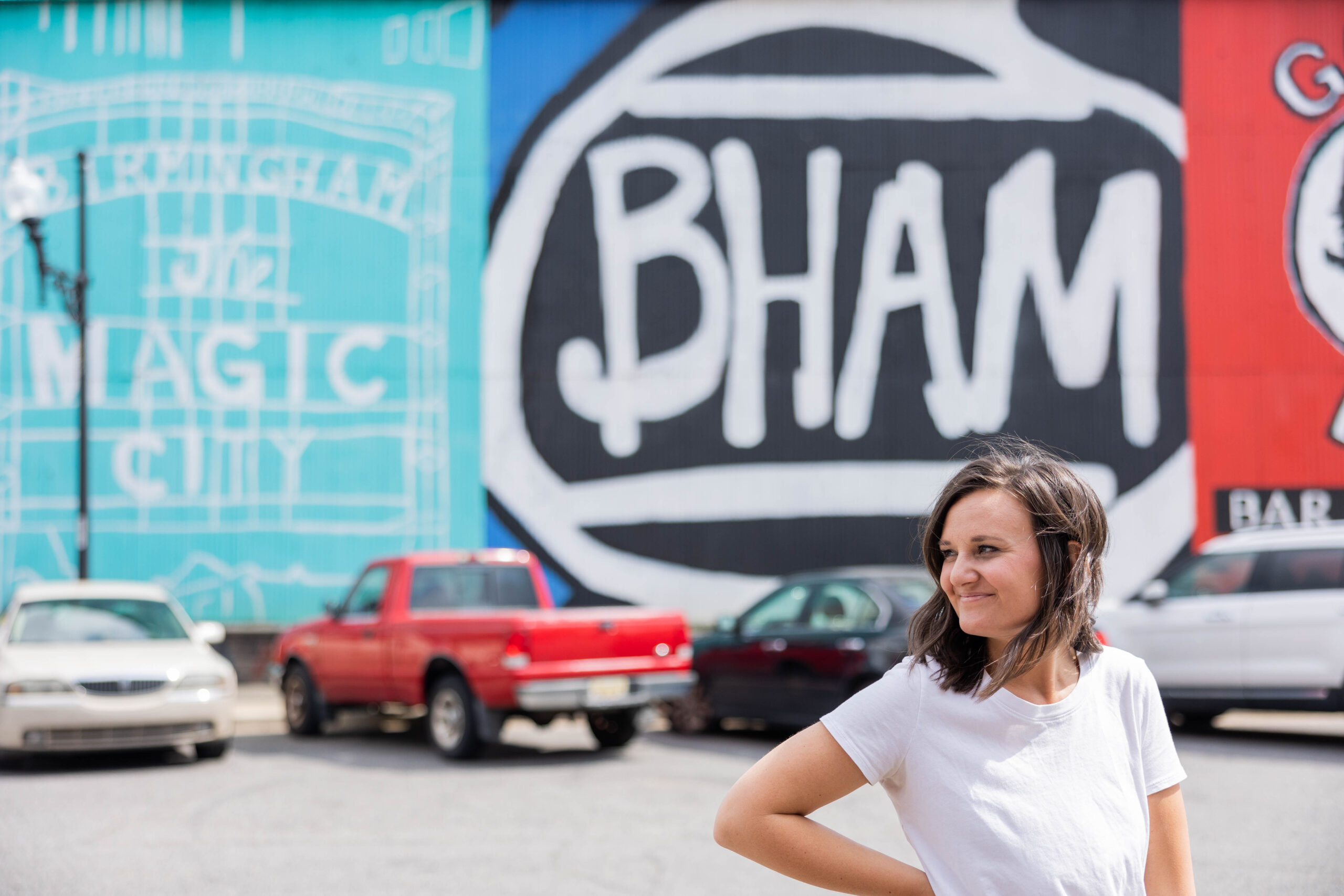 Eleanor Stenner photographed in front of Birmingham murals.