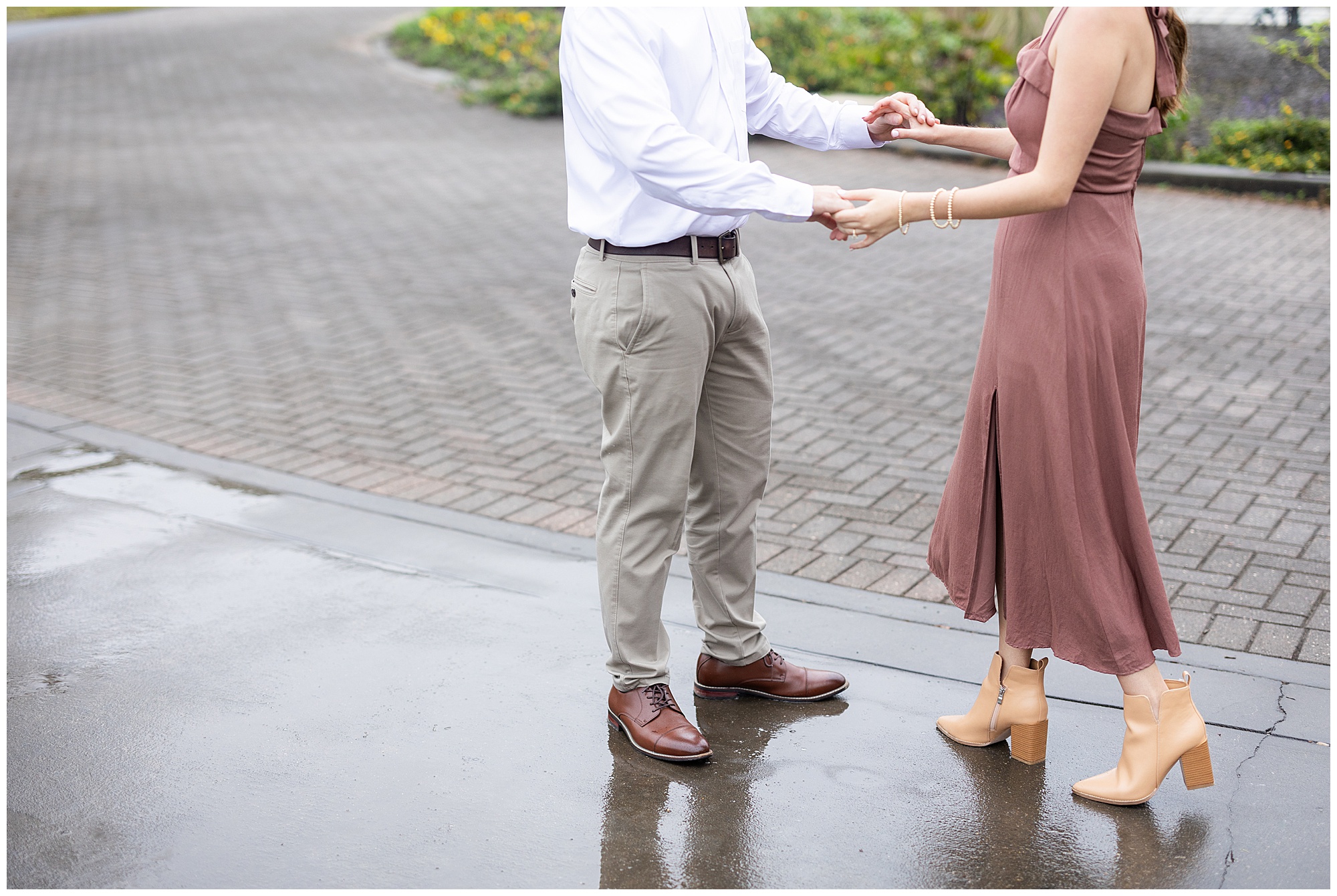 Catherine and Jake hold hands as they walk around the Botanical Garden's greenhouse. 