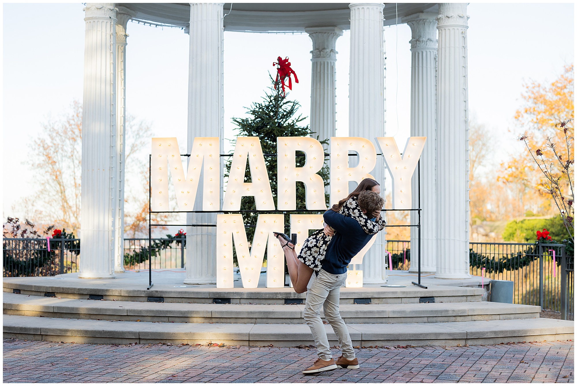 Camden hugs Olivia and lifts her into the air.