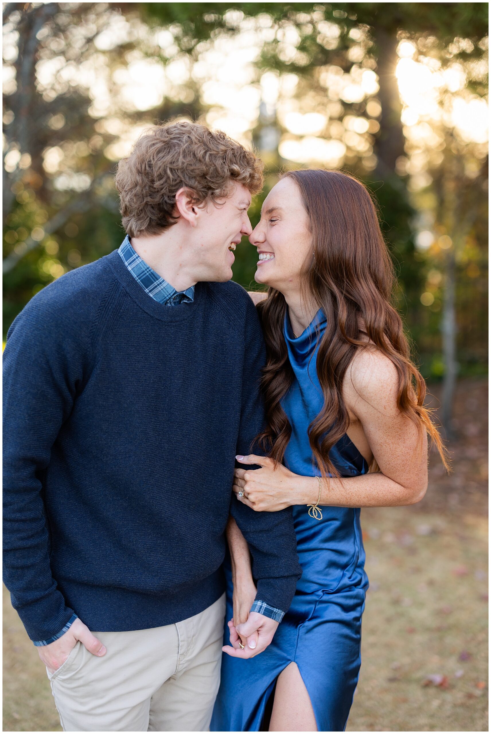 Camden and Olivia laugh and smile at each other. 
