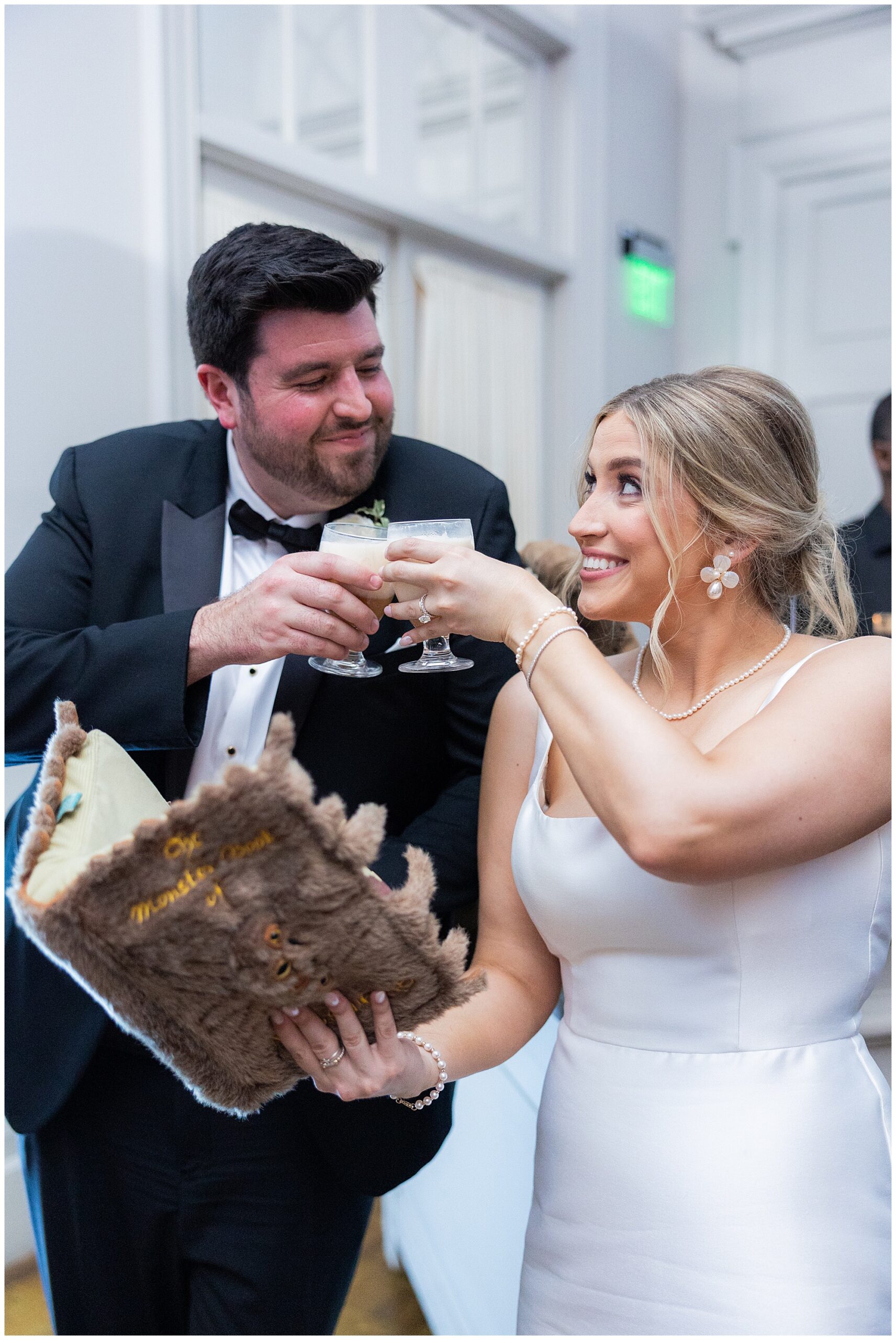 Faith and James clink their glasses together - they're filled with butter beer from Harry Potter! 